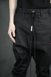 TAPERED DROP CROTCH TROUSERS 65 COATED BLACK